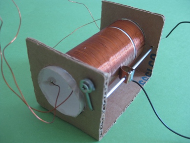 Compact homemade tunable coil for crystal radio made with cardboard form.