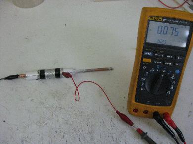 Measuring the capacitance of the barium titanate and epoxy
      cylinder.