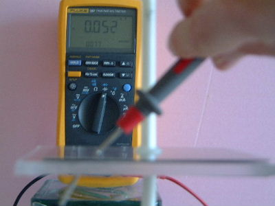 Measuring capacitance of lucite acrylic capacitor.