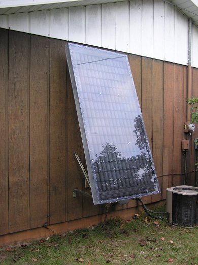 Pop can solar air heater mounted on wall.