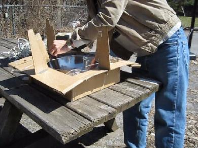 Attaching the vertical supports for the solar cooker that'll hold the cone in place.