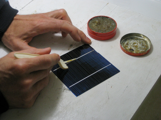 Applying flux paste to the front of a solar cell for my DIY/homemade solar panel.