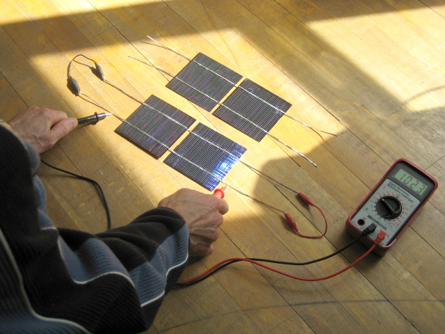 Testing two connected solar cells.