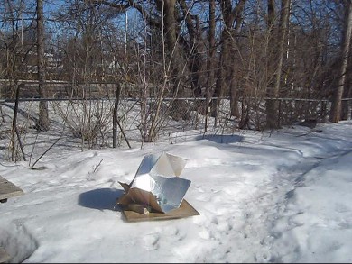 Solar cooking in winter with snow all around using my
      Modified CooKit solar cooker.