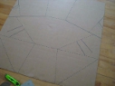 The cardboard for the Modified 
        CooKit solar cooker all marked out.