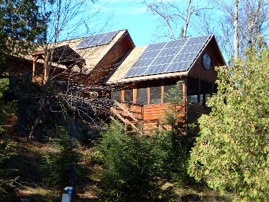 Photovoltaic/solar panels on a house in an off-grid system.