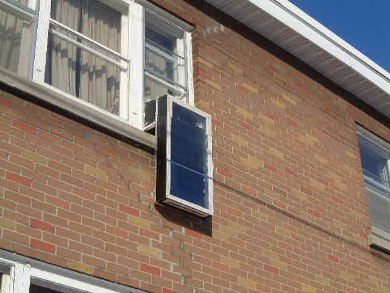 Outdoor-to-indoor window solar air heater exterior view.
