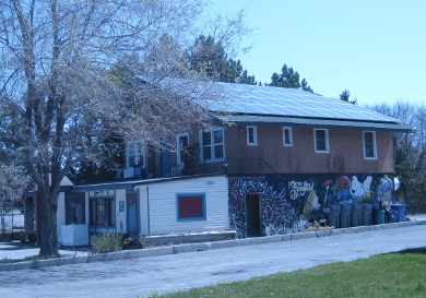 A restaurant with solar panels on its roof.