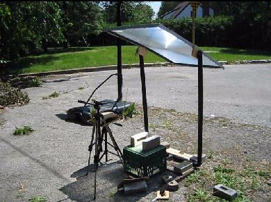 The fresnel lens solar cooker setup.