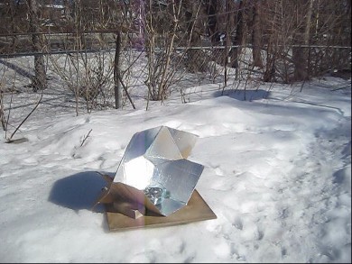 Solar cooking using my modified CooKit in the winter snow.