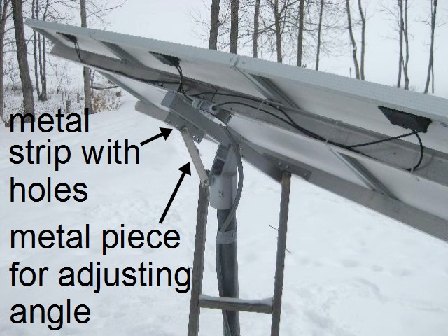 Adjusting the solar array angle using holes in a metal strip.