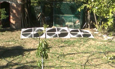 Another view of the completed homemade solar pool heating panels.
