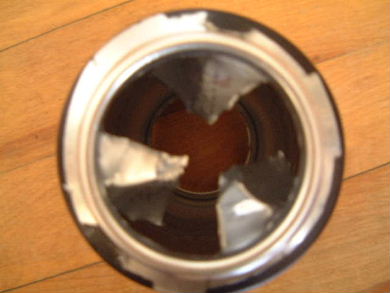 Vanes cut in to a can to make the air take a convoluted path from can to can.