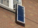 Outdoor-to-indoor window solar air heater.