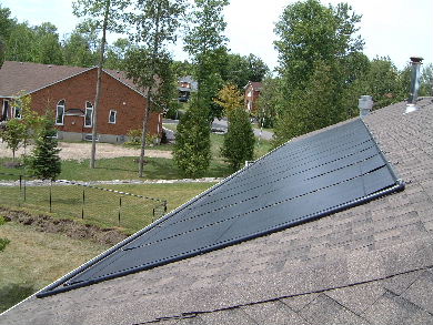Solar pool heating panels on a roof - view from the roof.