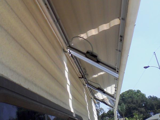 Underside of RV solar panels showing connectors and wires.