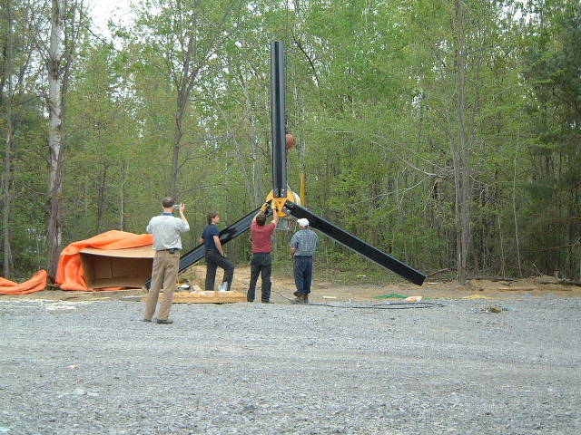 Blades being bolted to the wind turbine.