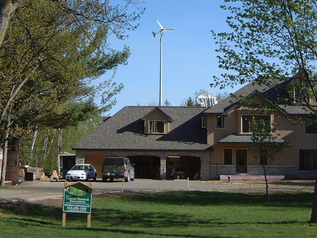 View of the wind turbine behind the house.