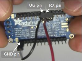 Pins for putting the Adafruit Audio FX Sound Board into UART 
      mode, including the UG, RX and a GND pin, bottom view.
