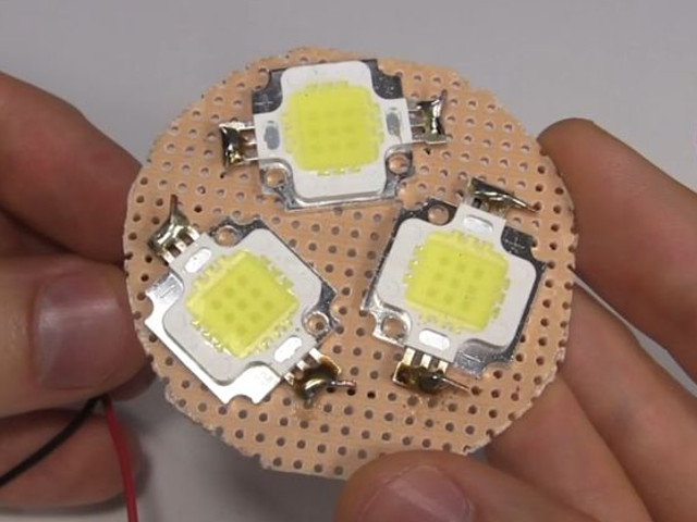 3 10 watt LEDs soldered on a breadboard.