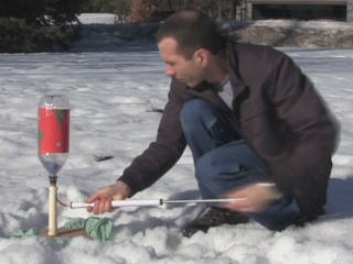 Photo of me pumping air into a bottle rocket prior to launching it.