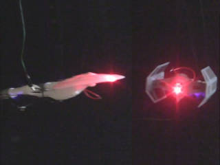 TIE fighter and Star Trek Enterprise models with lasers.