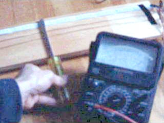 Measuring UHF oscillator output using a lecher line.