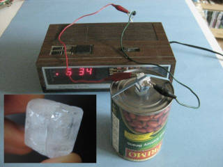 A speaker made from a can with a piezoelectric crystal strapped on top and being powered by a radio.