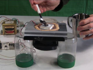 Testing a TEC Peltier module sitting on a heat sync by putting water on it to form ice.