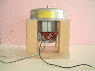 Vacuum cleaner motor mounted in a support structure.