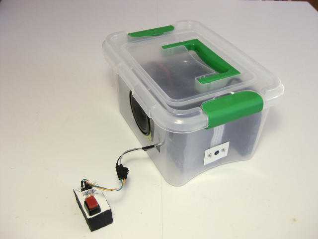 Photo of Obbi, the object recognizer in a box with the box closed.