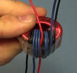 The finished coil on the toroid core for the joule thief powering a CFL.