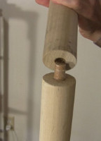 Connecting the two 4 foot poles with a smaller dowel.