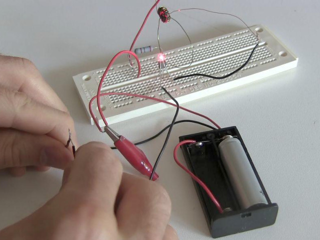 Using a joule thief to light an LED.