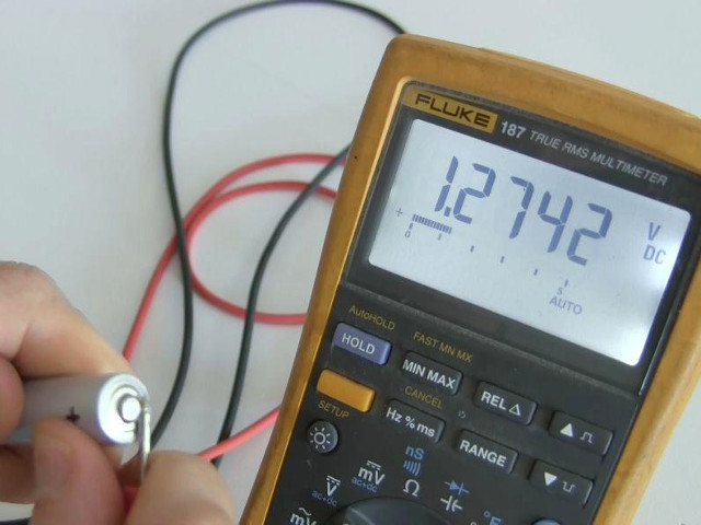 Measuring the battery voltage with a digital multimeter (DMM)<br />       and getting 1.27, not enough to run the LED.