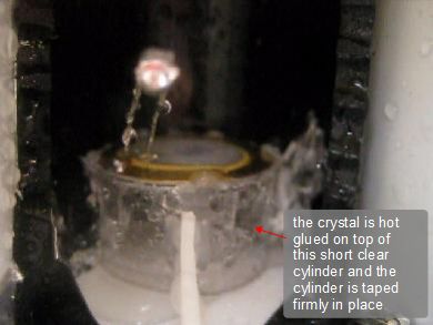 Showing the pizeoelectric crystal glued to the top of a cylinder.