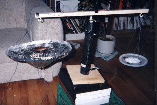 T.T. Brown Bahnson labs test diagram with saucer suspended
      using a balance.