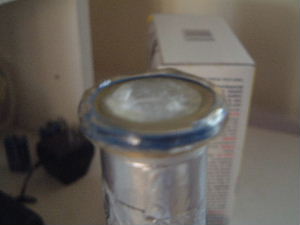 A paraffin wax plug is inserted in the cylinder while the
      resin hardens on the vinyl tube.