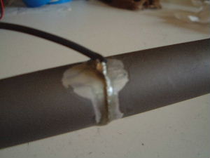 The wire attached to the outer electrode for 
      the electric field thruster.