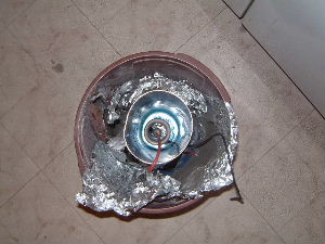 Top view of the electric field thruster and mold sitting in
      a bucket.