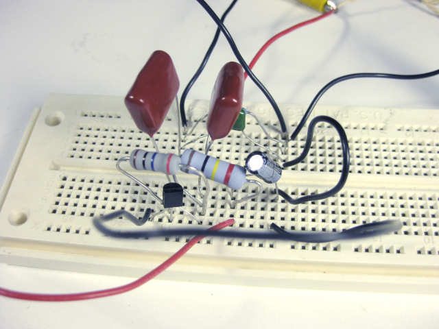 The main components of the single transistor crystal radio amplifier mounted on a breadboard.