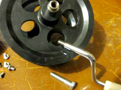 The Wimshurst machine's orginal crank and a replacement bolt.