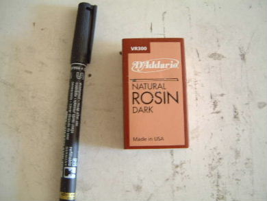 Natural Rosin, Dark - available at music stores for putting on violin bow string.