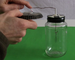 Inductively charging an electroscope using bottom of the electret.