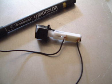 Piezoelectric igniter trigger and crystal.