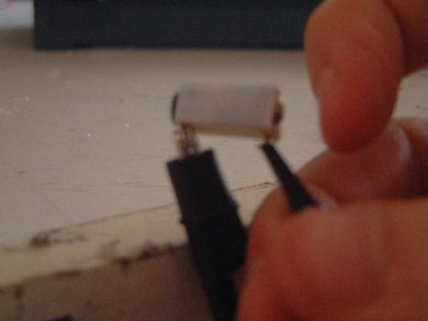 Flicking the piezoelectric igniter's crystal with my fingertip.