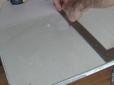 Cutting the glass for the glazing for the mini screen solar air heater.