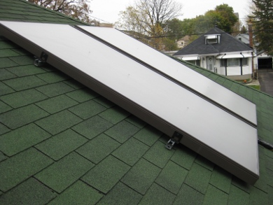 Side view of two Enerworks flat plate collectors on the roof.