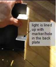 3. Angle the sun finder and book cover upward until the light meets the marker/hole in the back plate of the sun finder. If it doesn't line up then you need to fix it so it does.