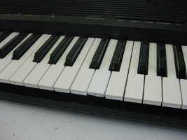The repaired piano/keyboard key.